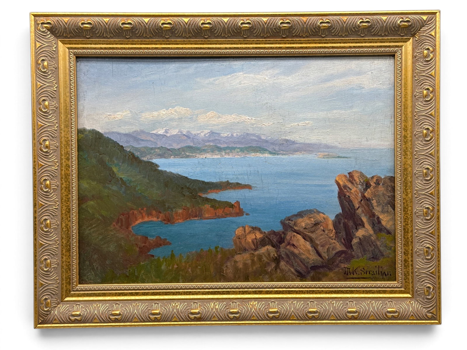 Mihran Serailian Oil/Panel: Landscape: Mihran Serailian (American, 1867-1957). An oil on panel landscape signed lower right and gilt framed. Inscribed verso "View from Miramar - Near Cannes looking over eastern shores miles away and the sn