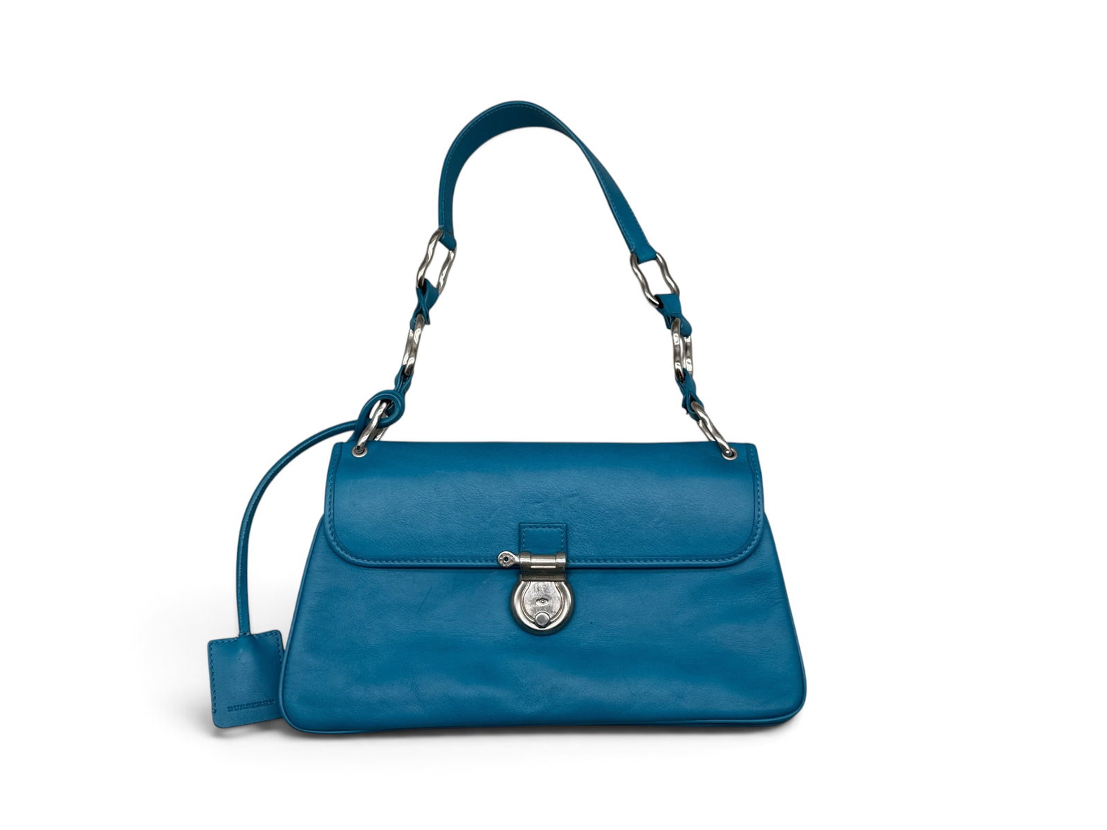 Burberry Cerulean Leather Shoulder Bag: A Burberry cerulean-hued leather shoulder bag with silver-tone hardware, marked Burberry. Interior has Burberry check, marked on interior. 6-1/2in tall x 11in wide. | You have additional shipping