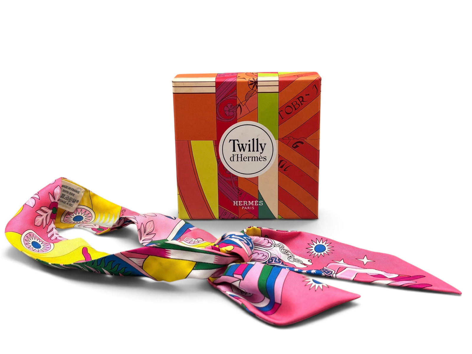 Hermes La Source de Pegase Twilly Scarf: An Hermes silk La Source de Pegase Twilly scarf with technicolor botanical and horse themed motif. Includes original Hermes box. 34in long. | You have additional shipping options, and are not required