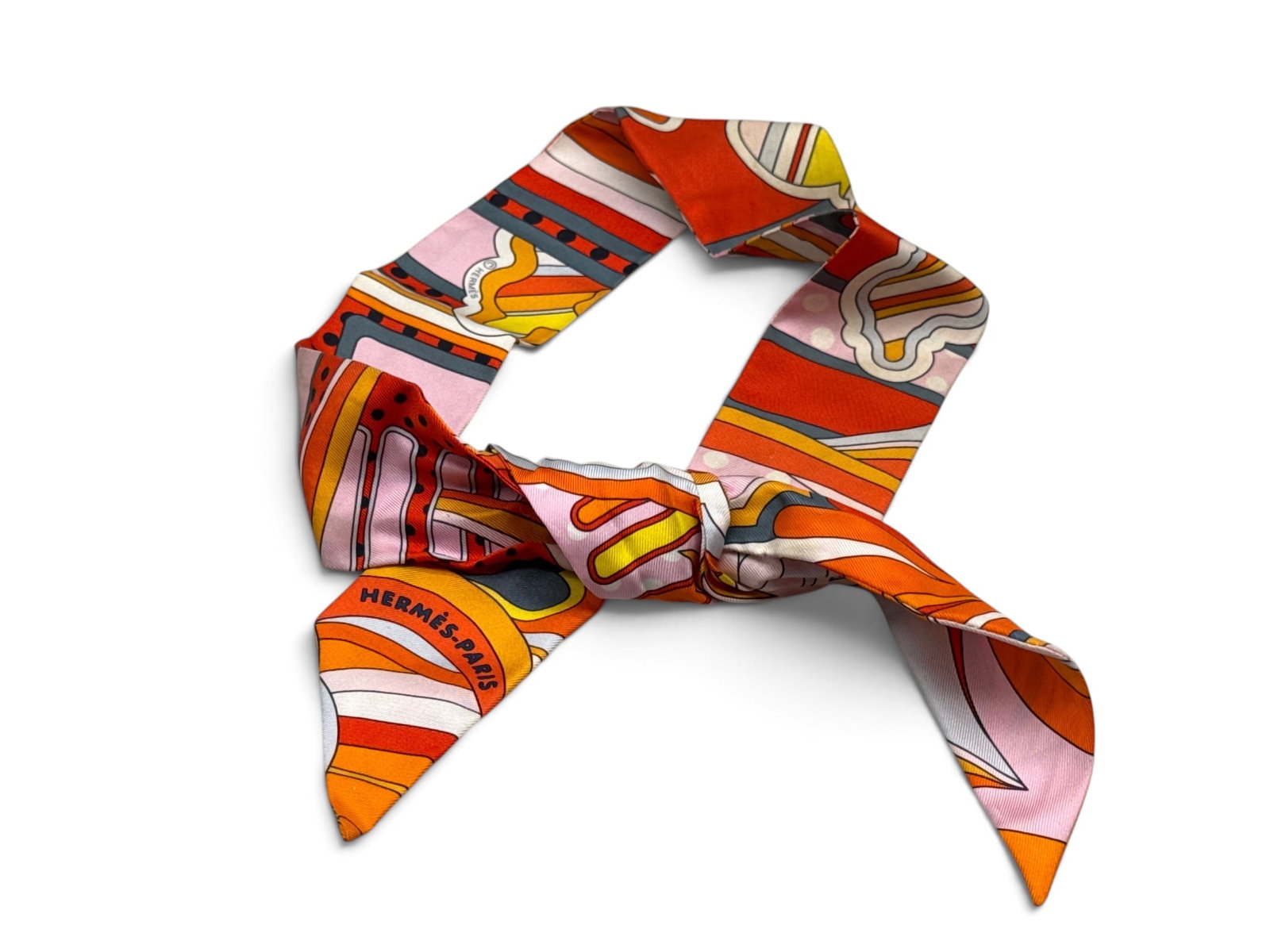 Hermes Twilly 86 Silk Scarf: An Hermes Twilly 86 silk scarf with vibrant pop art motif. Marked Hermes. 34in long. | You have additional shipping options, and are not required to use Live Shipping. Additional shipping and delivery