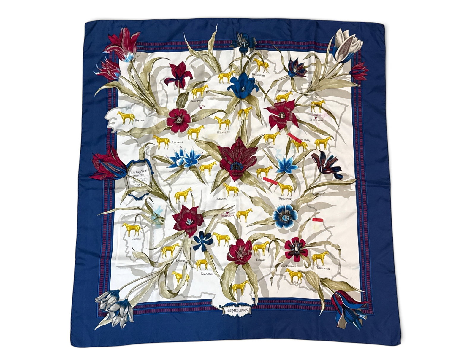Hermes La France Hippique 1854 Silk Scarf: An Hermes Paris La France Hippique 1834 scarf with botanical and horse motif. Marked Hermes. Includes Hermes box and ribbon. 34in tall x 33-1/3in wide. Staining and discoloration. | You have additiona