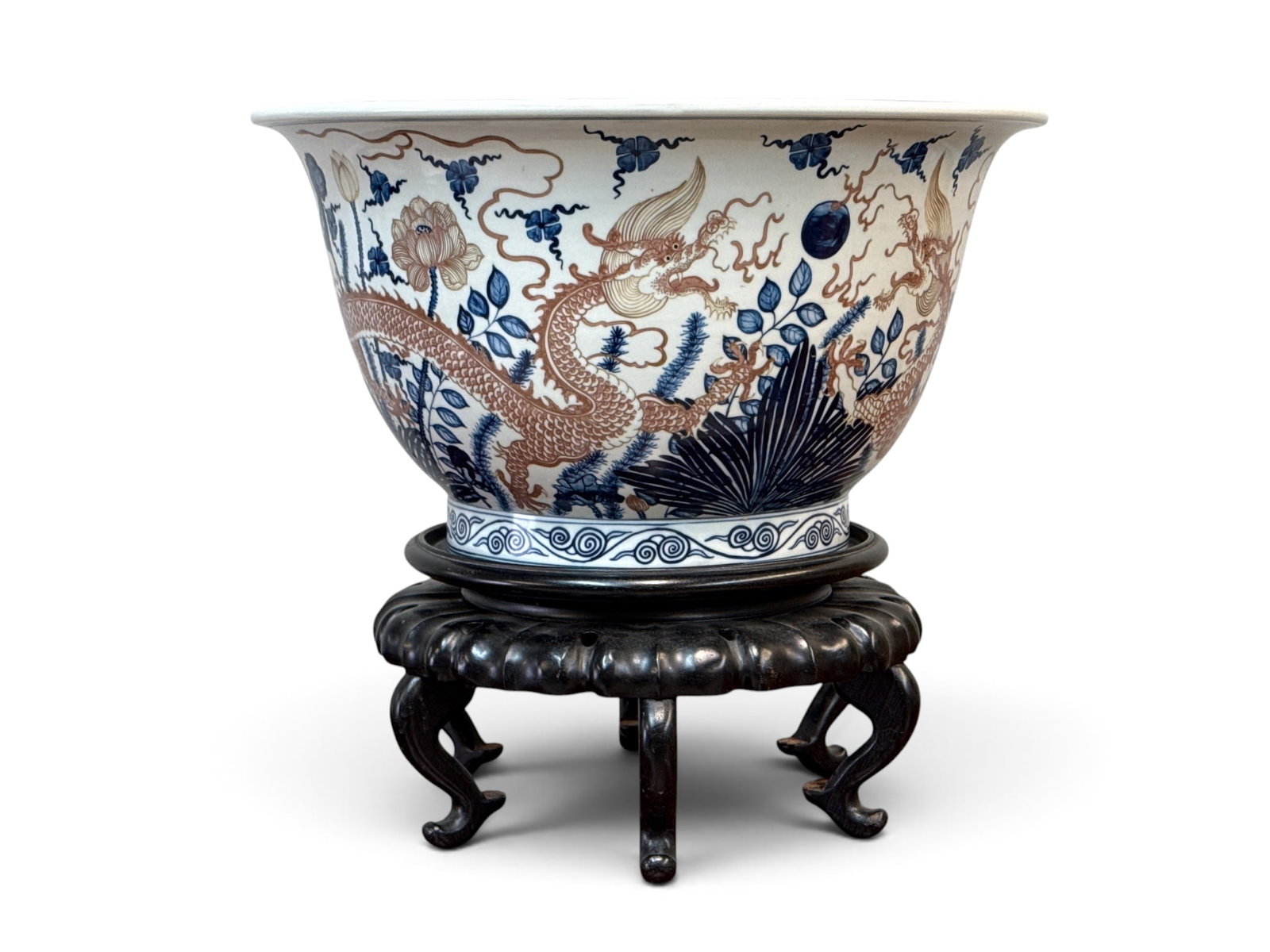 Large Chinese Porcelain Dragon Center Bowl on Stand: A large Chinese porcelain center bowl with dragon-decorated exterior and fish interior, and seal mark on base. Resting on a hardwood stand. Bowl (excluding stand): 11-1/2 in x 20-3/4 in. With base: 18