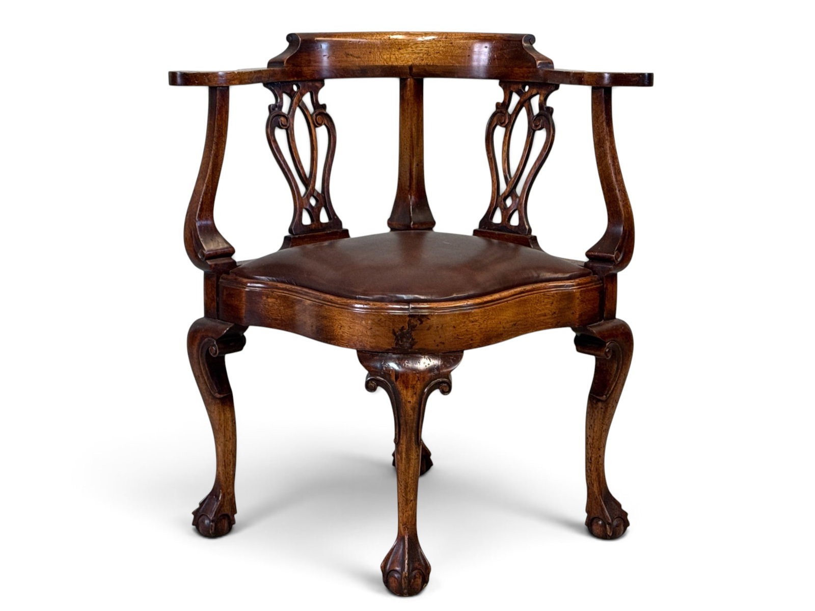 Chippendale-style Mahogany Corner Chair: A Chippendale-style mahogany corner chair with a double chair back, shaped seat, and cabriole legs ending on ball and claw feet. 32in tall x 29-1/2in wide x 25in deep. | You have additional shipping o