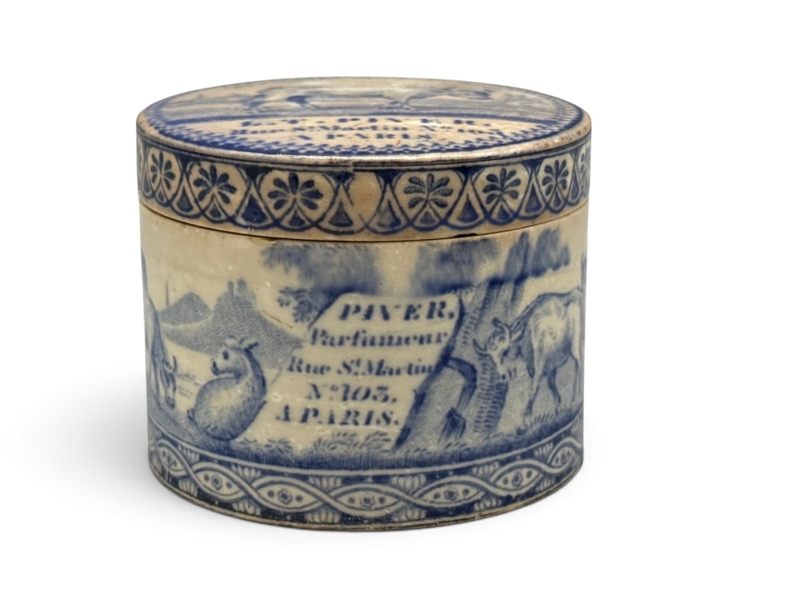 19th C. L.T. Piver Advertising Pomade Pot: A 19th C. French pomade pot for L.T. Piver (Rue St Martin, Paris) with blue transferware pastoral scenes. Numbered 2355. 2in tall x 3in wide. | You have additional shipping options, and are not requir