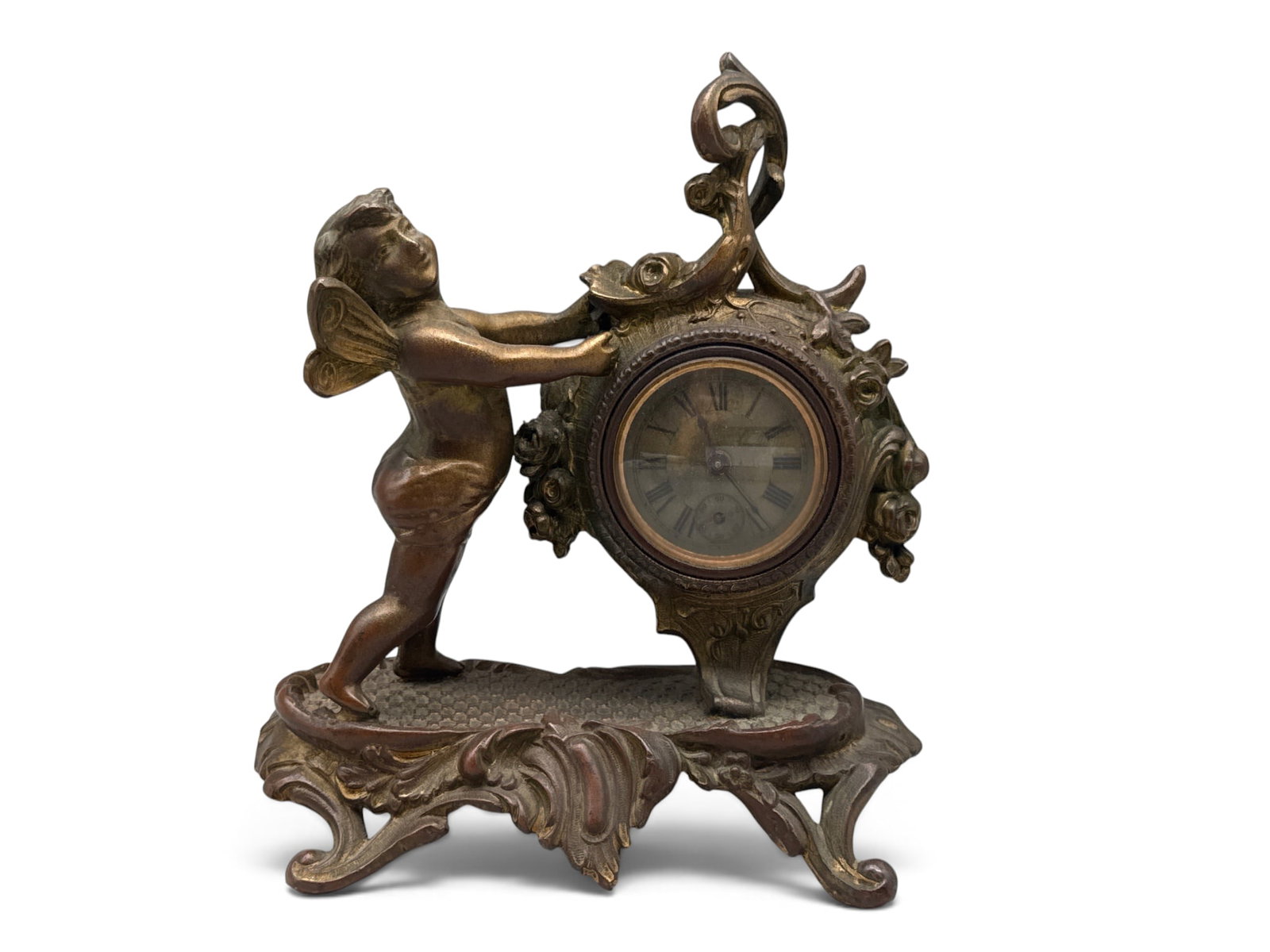 19th C. Rococo-style Bronze Cupid Desk Clock: A 19th C. Rococo-style bronze clock with cupid figure to the left of a swag-decorated clock. Dated 1891 verso. 8in tall x 6in wide. | You have additional shipping options, and are not required to use 