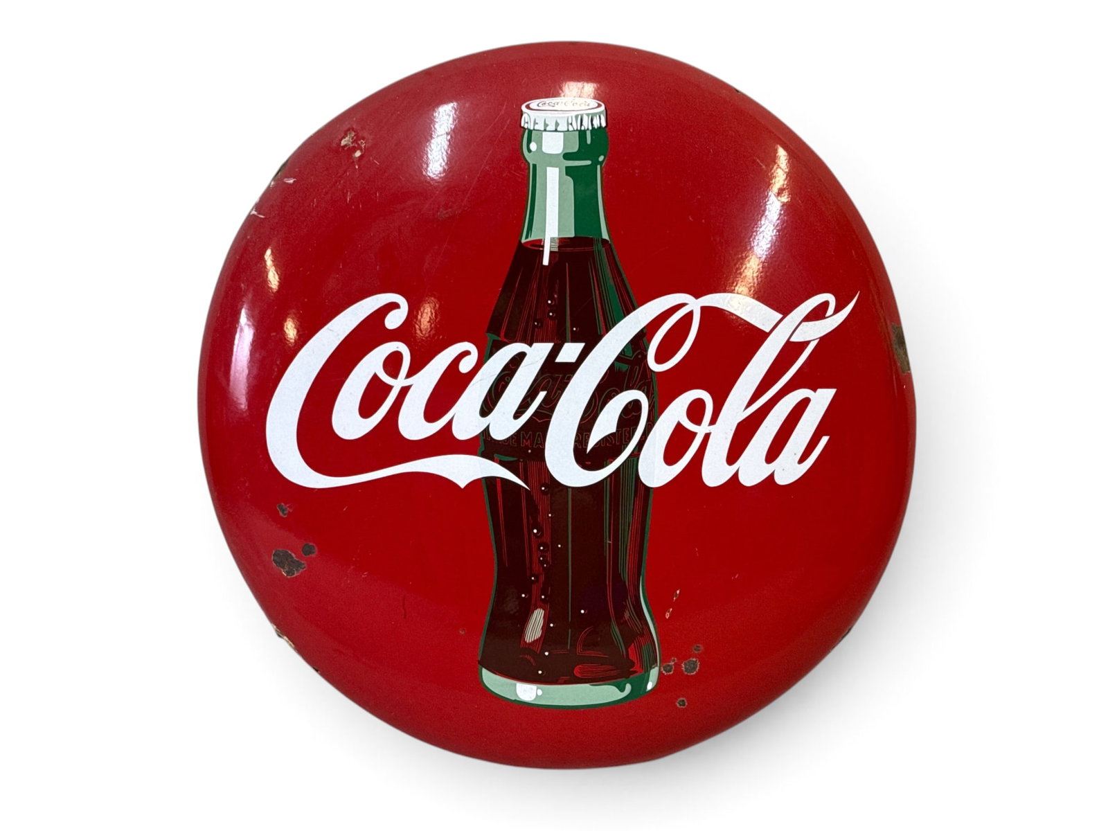 Coca-Cola Porcelain Button Advertising Sign: A Coca-Cola porcelain button advertising sign with bottle graphic. 36in diameter. | You have additional shipping options, and are not required to use Live Shipping. Additional shipping and delivery de