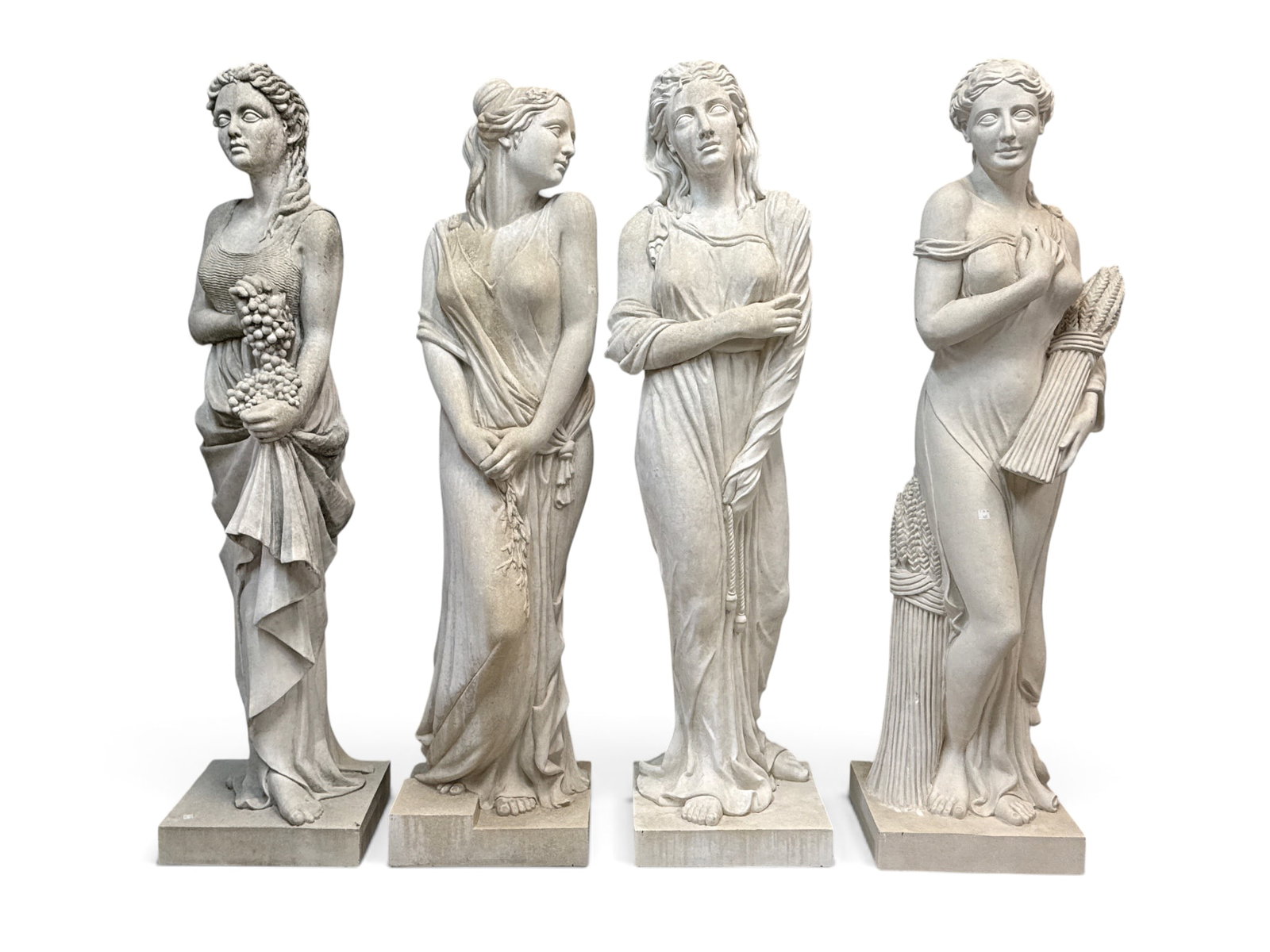 Four Large Cast Stone Four Seasons Sculptures: A set of four large cast stone garden sculptures depicting the "Four Seasons". All approx. 57in tall. | You have additional shipping options, and are not required to use Live Shipping. Additional