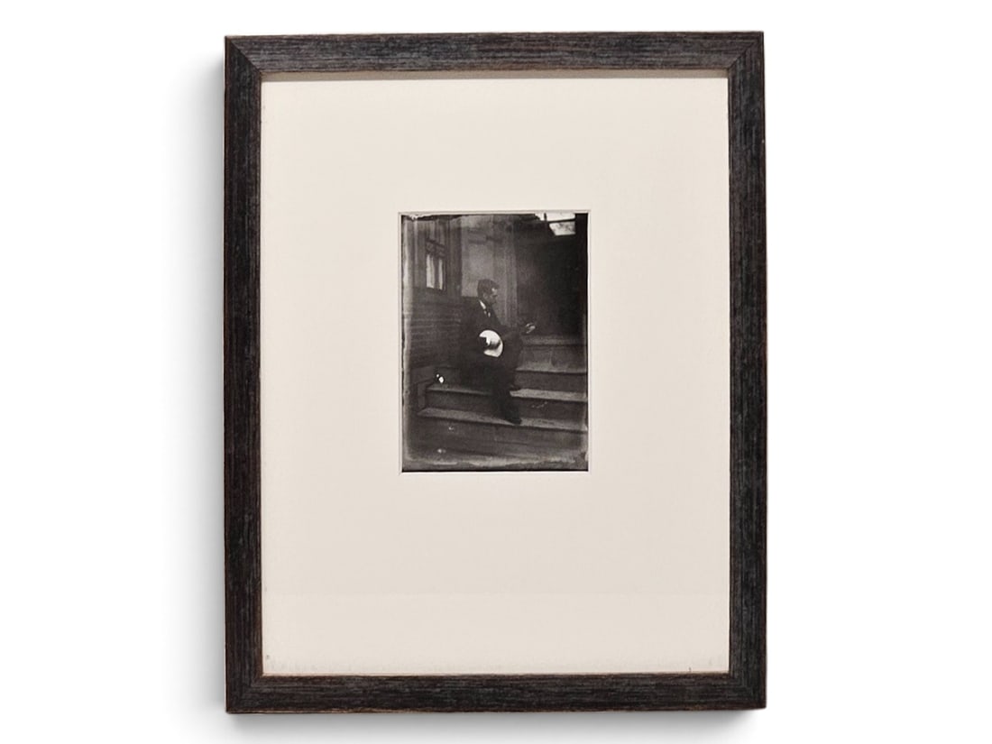 Attrib. Eakins Silver Gelatin: Quinn Playing Banjo: An attributed to Thomas Eakins (Philadelphia, 1844-1916) silver gelatin print from original glass negative, depicting Quinn playing a banjo on steps. Attributed verso by Pedersen Gallery tag, dated 18