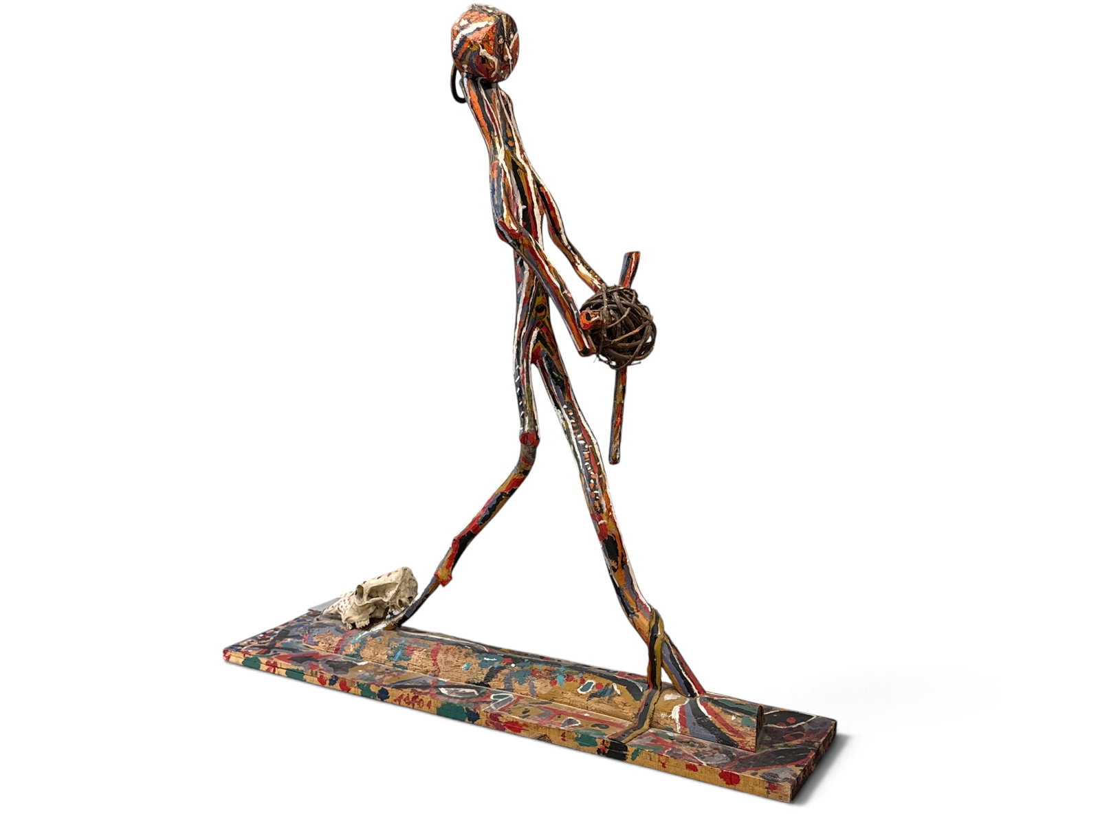 Italo Scanga Large Format Figural Sculpture: Italo Scanga (American, 1932-2001). A large carved and painted found wood sculpture of a figure holding a ball. Appears to be unsigned. Includes reference books and material. 86in tall x 84in tall x 1