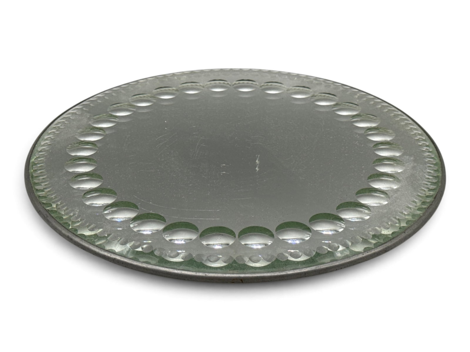 Early 20th C. Sorcerer's-style Mirrored Plateau: An early 20th C. sorcerer's-style mirrored plateau with ovoid beveled edge detail, sitting on ball feet. 1/2in tall x 8in diameter. | You have additional shipping options, and are not required to use 