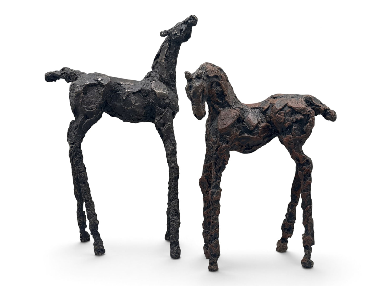 Two Brutalist Bronze Horse Figures: A pair of brutalist bronze horse figures with elongated legs. 14in tall x 10in wide. | You have additional shipping options, and are not required to use Live Shipping. Additional shipping and delivery