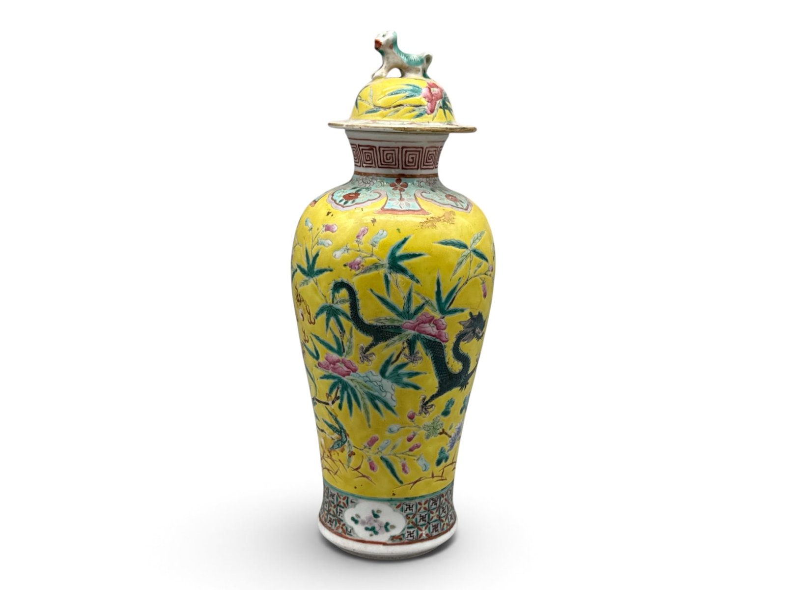 Chinese Famille Jaune Ginger Jar Vase: A Chinese famille jaune ginger jar vase of baluster form with figural dog finial, decorated with dragon motif on a botanical background. 12-1/2in tall x 4in wide. | You have additional shipping
