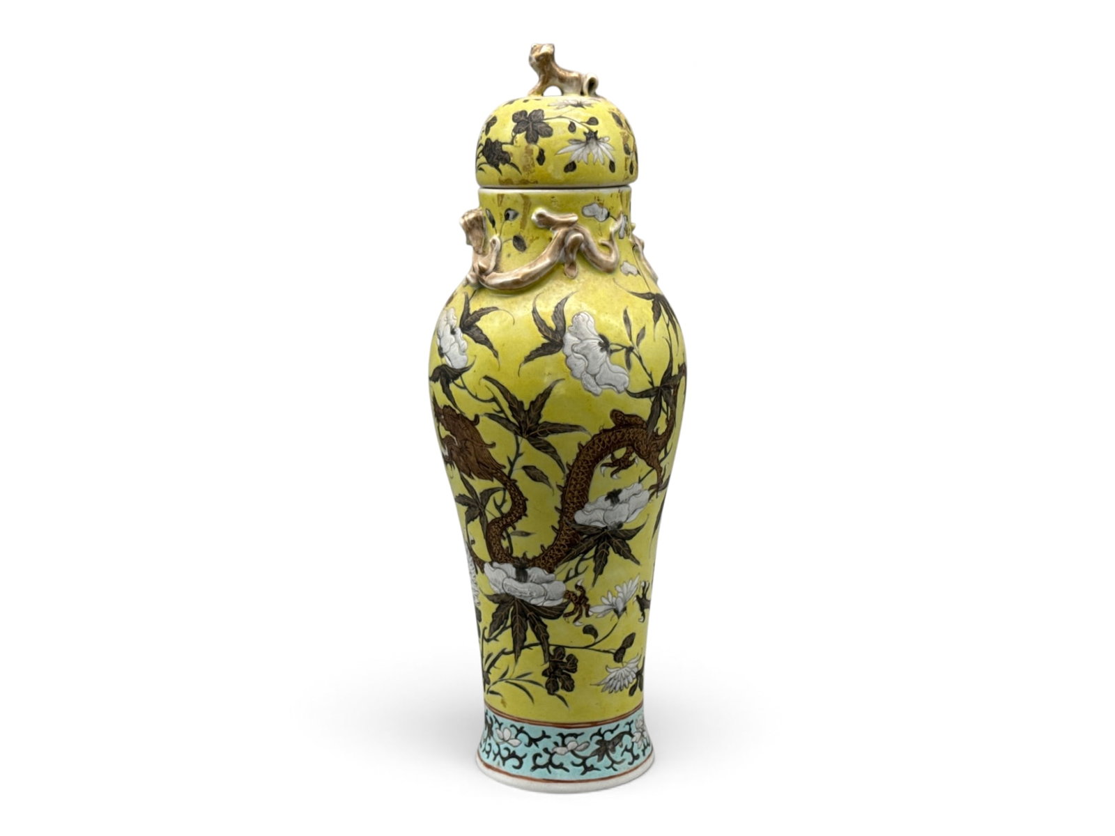 Chinese Famille Jaune Lidded Vase: A Chinese famille jaune lidded vase with applied high relief dragon decoration, dragon motif background with chrysanthemums, and dog form finial. 13-1/2in tall x 4in wide. | You have additional