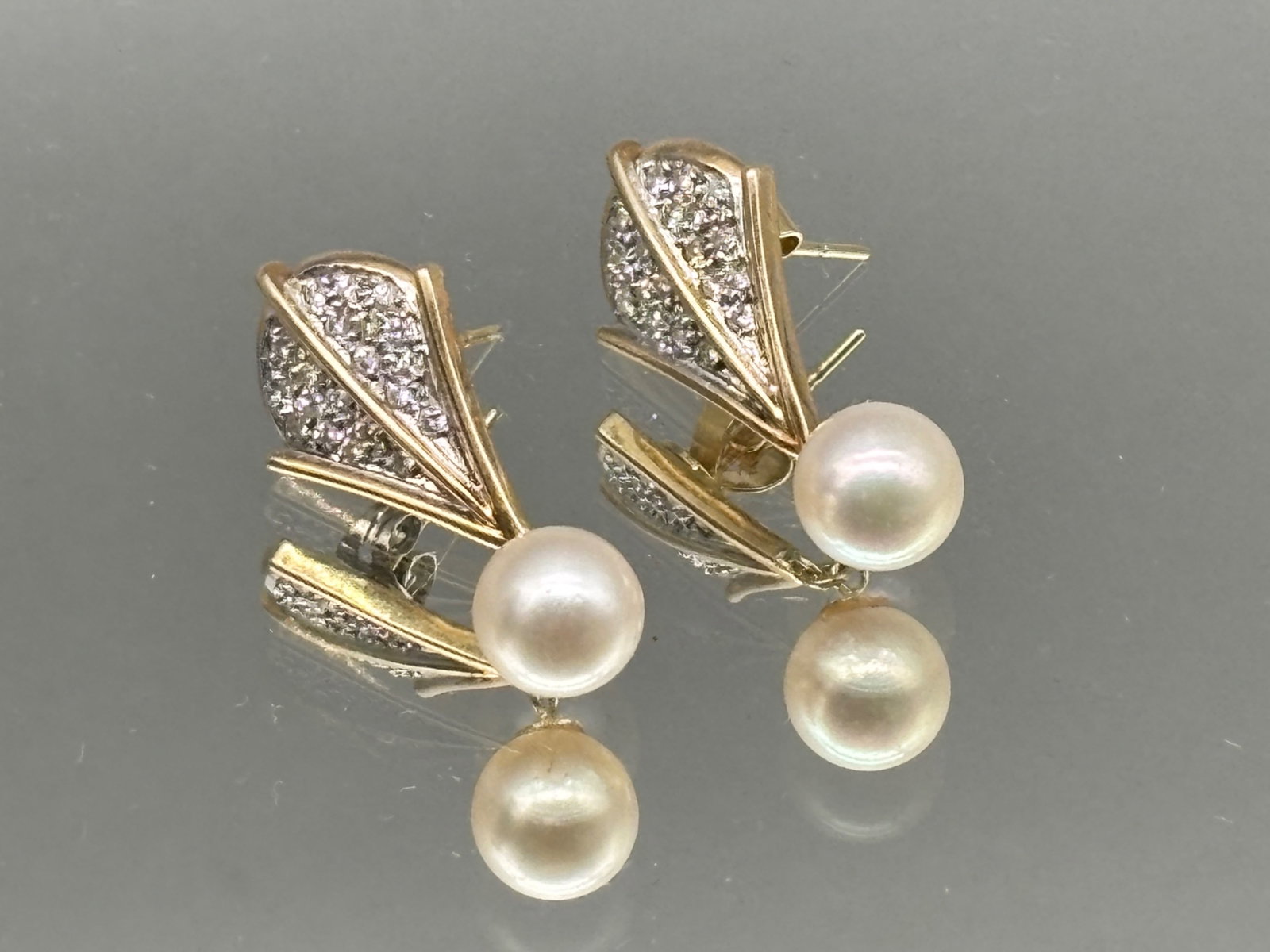 14K Pave Diamond and Pearl Earrings: A pair of 14K yellow and white gold earrings with pave diamonds and pearl drops. Tests as 14K. 1in tall x 1/2in wide. 3.85 dwt. | You have additional shipping options, and are not required to use