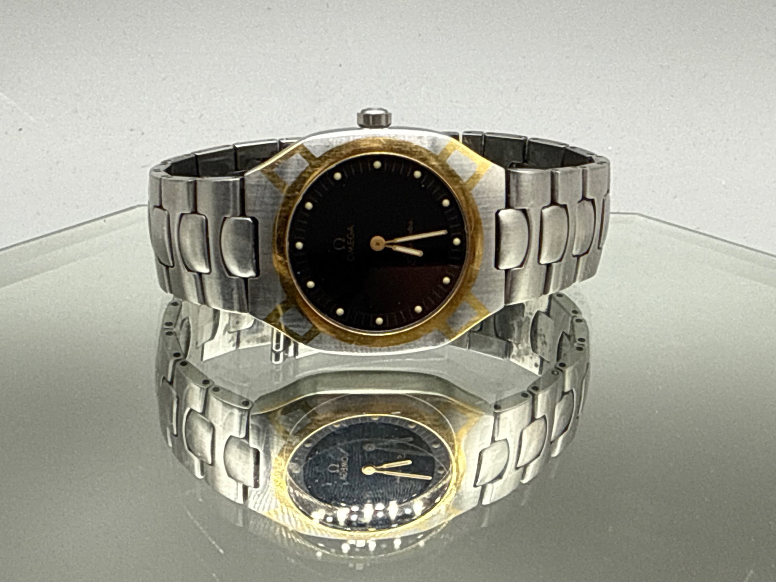 Omega Seamaster Polaris Watch: An Omega Seamaster Polaris watch having a two-tone stainless steel case with gold tone inlay. Marked Omega on bracelet, and Seamaster verso. Serial number: 53810339. Bracelet: 2-1/2in diameter. | You