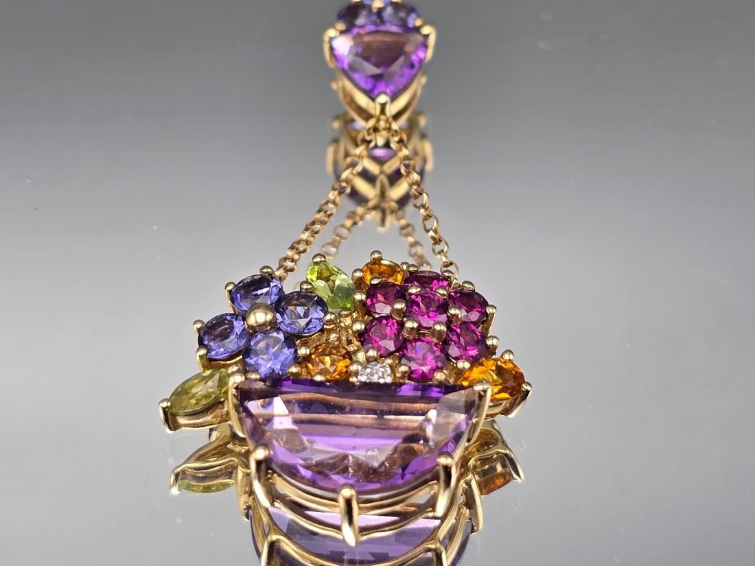 14K Pendant with Amethyst, Peridot, and Citrine: A 14K yellow gold basket-form pendant with amethyst, peridot, citrine, and diamonds. Marked 14K. 1-1/2in tall x 3/4in wide. 3.79 dwt. | You have additional shipping options, and are not required to