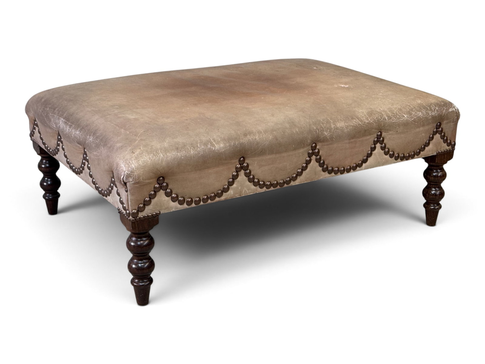 George Smith (Attrib.) Leather Ottoman: An attributed to George Smith ottoman with tacked leather upholstery and turned mahogany legs. Unmarked. 15in tall x 41in wide x 29-1/2in deep. | You have additional shipping options, and are not requ