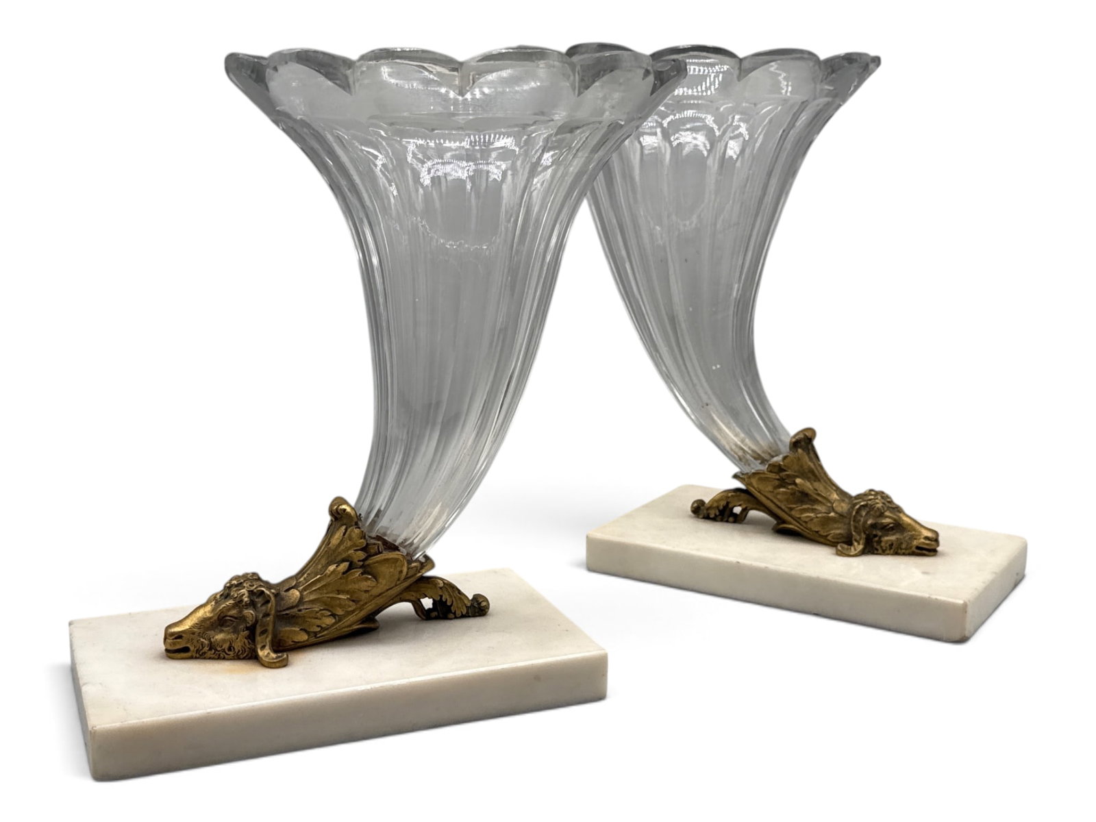 Pr. French Crystal Cornucopia Ram's Head Vases: A pair of Neoclassical-style French cut crystal vases with ormolu-decorated ram's heads mounted on marble plinths. 10in tall x 8in wide. | You have additional shipping options, and are not required to