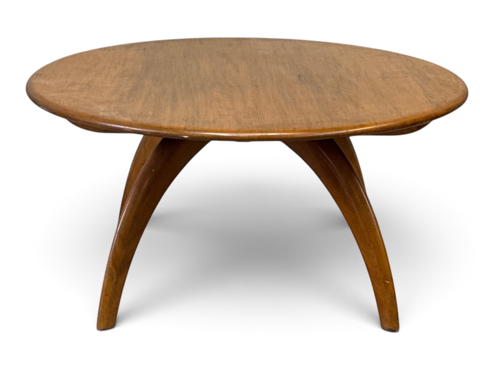 Heywood-Wakefield Revolving Cocktail Table: A midcentury modern Heywood-Wakefield round revolving cocktail or "Lazy Susan" table, with rotating top supported on four curved legs. 15-1/2in tall x 32in wide. | You have additional shipping options