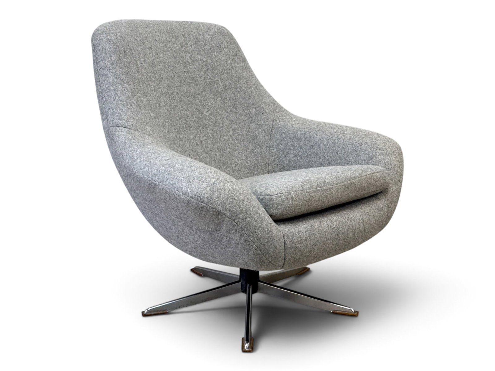 Overman-style Swivel Lounge Chair: An Overman-style upholstered swivel lounge chair on a metal star base. Unmarked. 32-1/2in tall x 32-1/2in wide x 30in deep. | You have additional shipping options, and are not required to use Live Shi