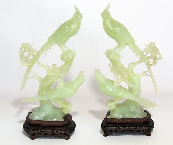 Pair of Chinese Carved Jade Birds: Pair of large Chinese jade carvings of birds on branches, each on teak base. Jade: 10-1/2” tall.