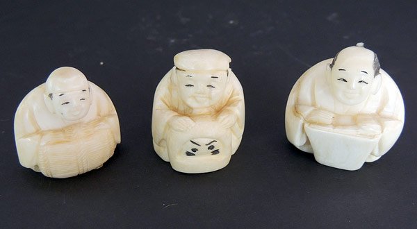 Three Antique Ivory Netsukes: Lot of three antique carved ivory netsukes: seated men. Tallest is 1-1/2”.