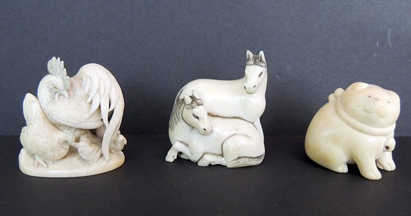Three Antique Ivory Netsukes: Lot of three antique carved ivory animal netsukes: seated cat (1-1/4” tall), grouping of chickens (1-5/8” tall), two horses (1-5/8” tall).
