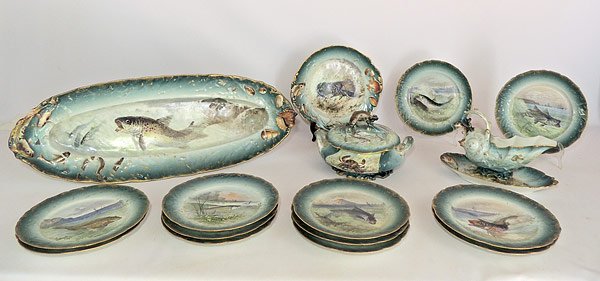 Limoges Porcelain Fish Service: Limoges, France 16-piece porcelain fish service, with hand-painted fish decoration, signed “Vivien”. Set consists of Platter (18” x 10-1/2”), Covered tureen (6” tall, 10-1/2” wide), Sauce 