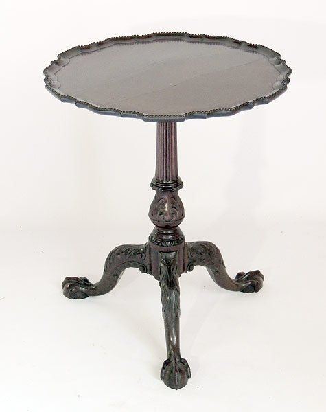 Chippendale Mahogany Table: 19th C. mahogany Chippendale-style table with piecrust top, carved legs and support, on ball and claw feet. 20-3/4” tall, 17-1/2”diameter.