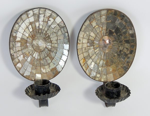 Pair of 19th C. American Tin Sconces: Pair of 19th C. American tin wall sconces with original oval mirrored backs and crimped drip pans. 9-3/4” tall x 6” wide.