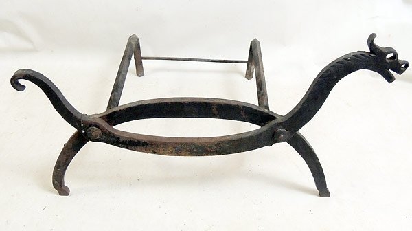 Cast Iron Log Holder: Cast iron log holder with arts and crafts dragon front. 15-1/2” tall, 27” wide, 21” deep. No maker's mark.