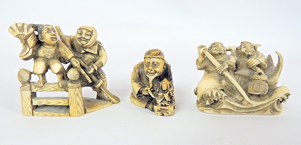 Three Antique Chinese Carved Netsukes: Three Antique Chinese carved netsukes: Two men riding a fish at sea (2" tall); Man and woman on fence (2-1/4" tall); Seated sculptor (1-1/2" tall).