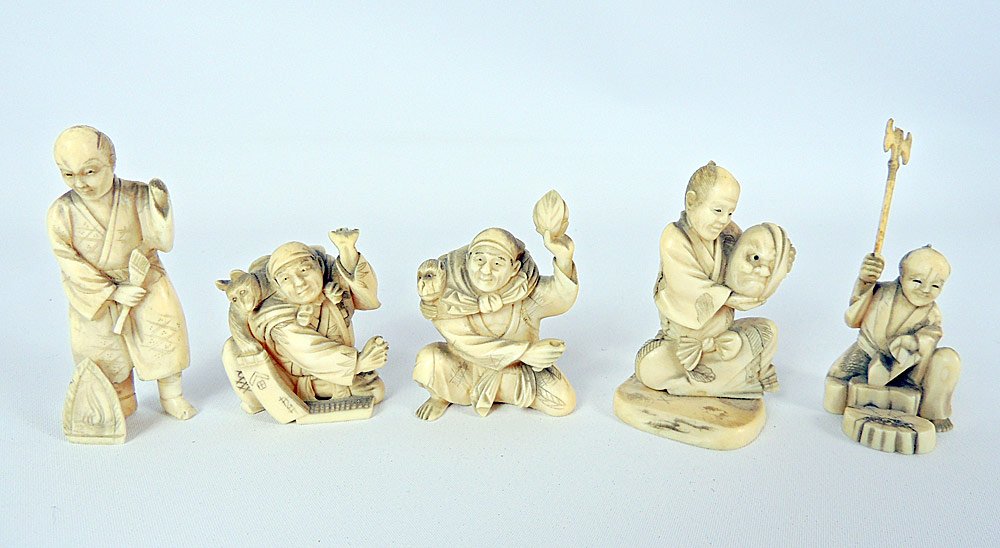 Five Antique Carved Chinese Ivory Figures: Grouping of five Chinese carved ivory figures: Man with axe (3-1/4" tall); Man holding a mask (3" tall); Seated man with dog (2-1/2" tall); Standing robed man (3-1/2" tall); Seated man with a monkey h