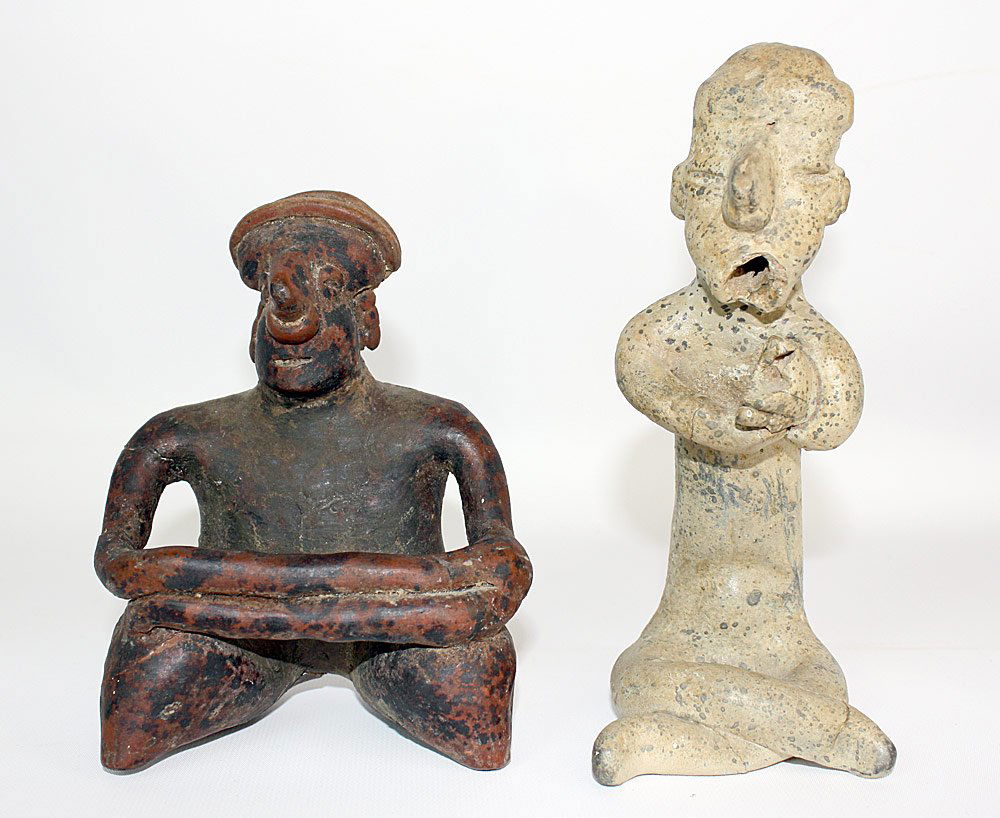 Two Pre-Columbian Pottery Figures: Two Pre-Columbian pottery figures of seated men: Redware with arms crossed: 6" tall x 4-1/2" wide; Cross-legged and holding a fish: 7-3/4" tall.