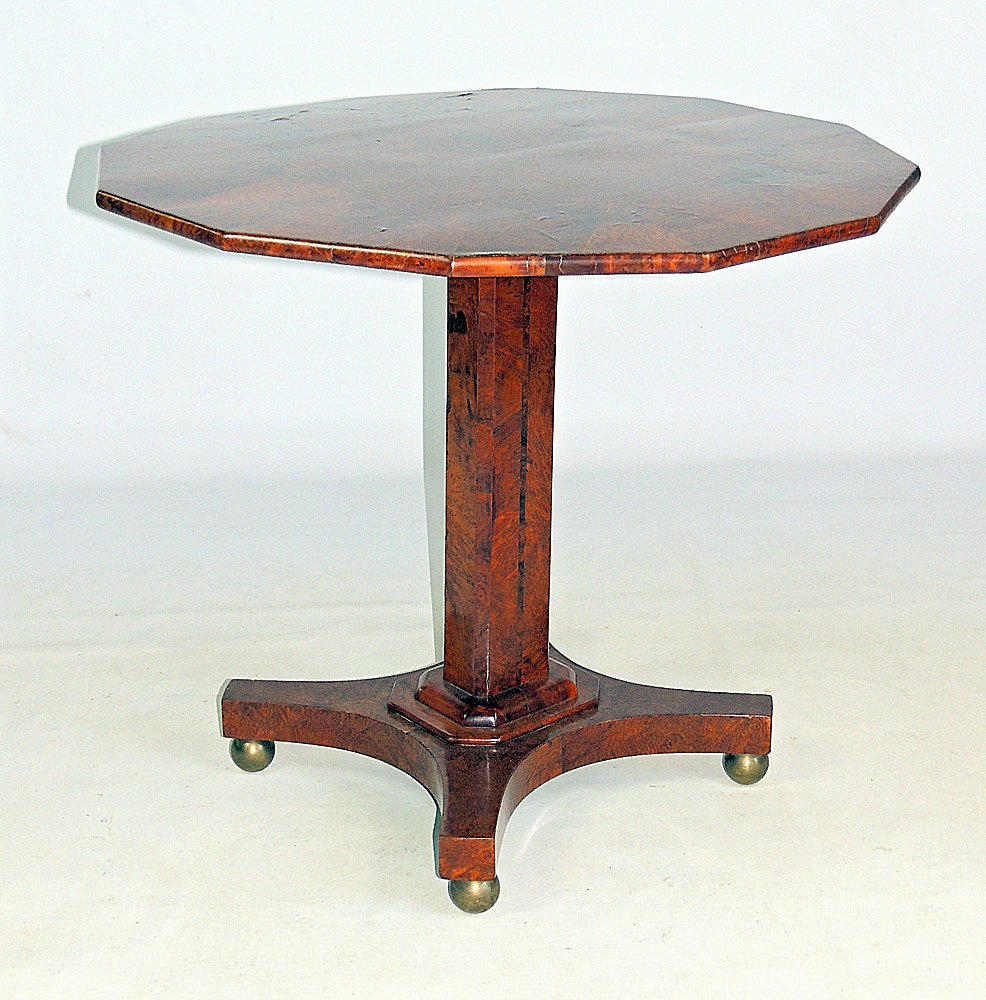 Burled Walnut Biedermeier Table: Burled walnut Biedermeier table with a 12-sided polygon top, on four brass ball feet. 27-1/2" tall; top: 31-1/2" diameter.