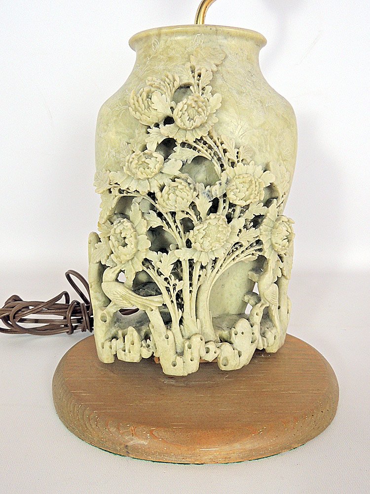 Carved Soapstone Lamp Base: Carved soapstone vase with a floral decoration, fitted as a lamp. Soapstone: 10" tall x 6-1/2" wide.