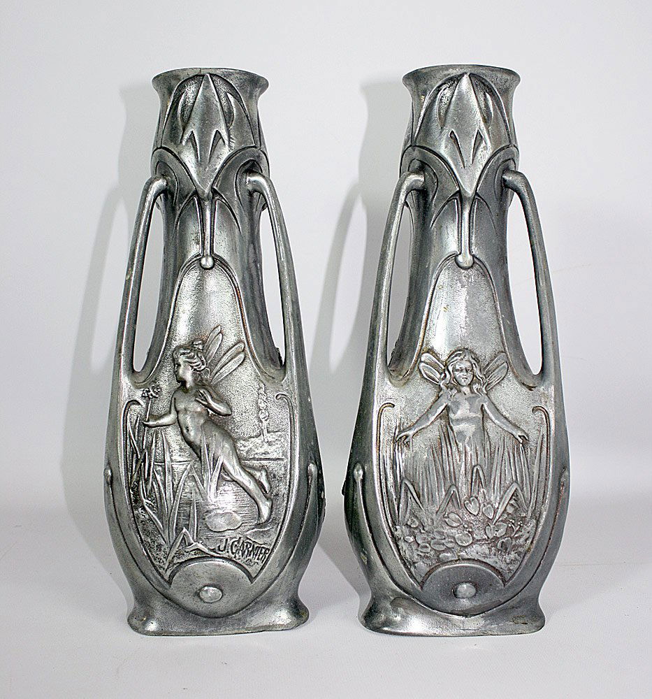 Pair of Jean Garnier Pewter Vases: Pair of Jean Garnier (French 1853 - 1910) Art Nouveau pewter vases with nymph relief molded decoration. Both signed "J. Garnier". 12" tall.