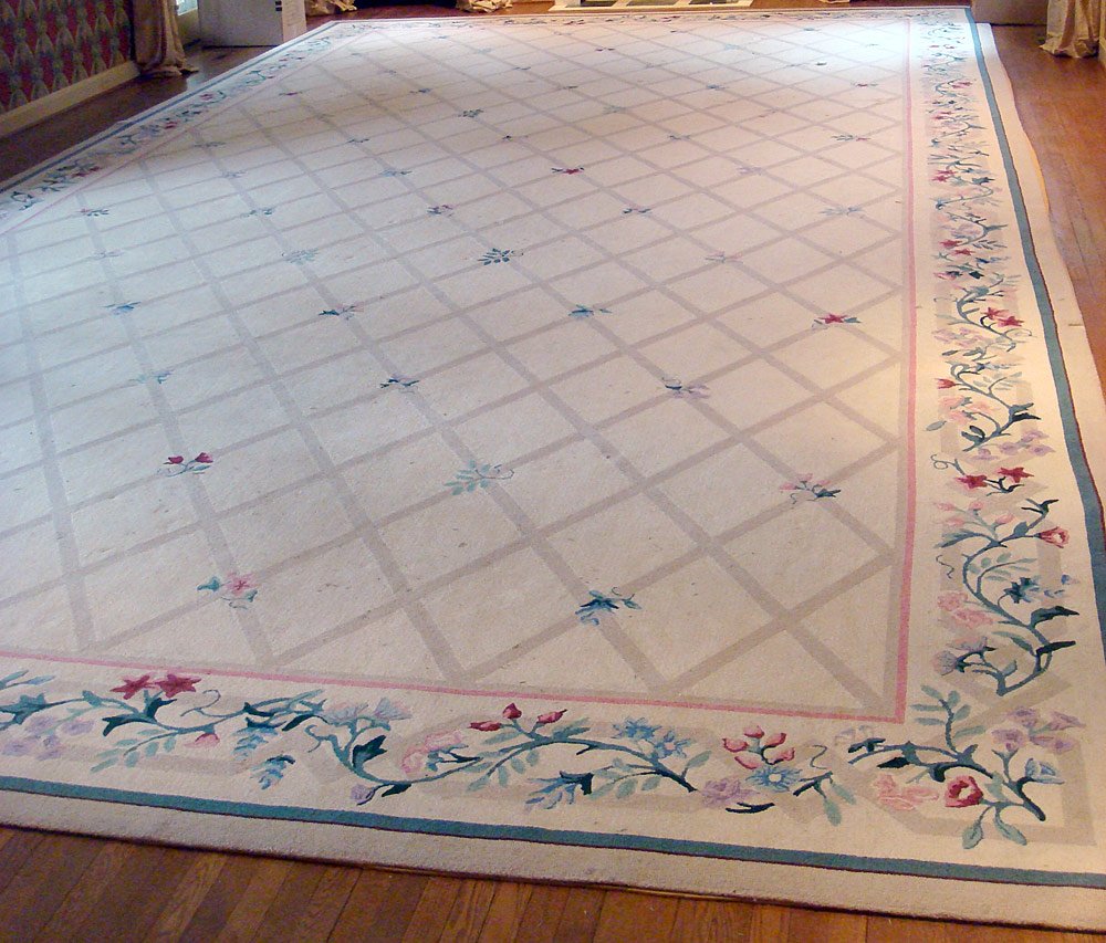 Edward Fields Carpet: Edward Fields palace-size hooked carpet with floral border on an ivory field. Approximately 30' x 15'.