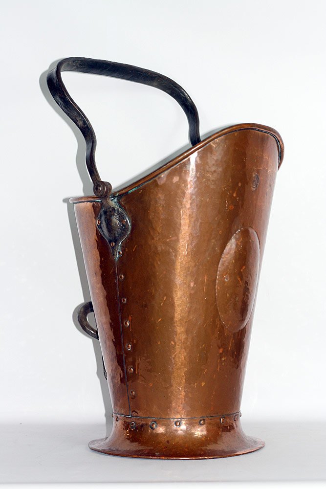 Gustav Stickley Coal Scuttle: Gustav Stickley coal scuttle, circa 1910. Hammered-copper scuttle with wrought iron handles. Stamp signature. 24" tall x 13" wide x 14" deep.