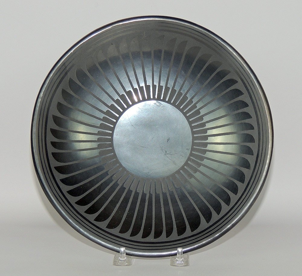 Maria Martinez / Popovi Da San Ildefonso Plate: Maria Martinez / Popovi Da San Ildefonso blackware plate featuring a repeating feather design. Signed "Maria Popovi" on base. 9-1/2" diameter.