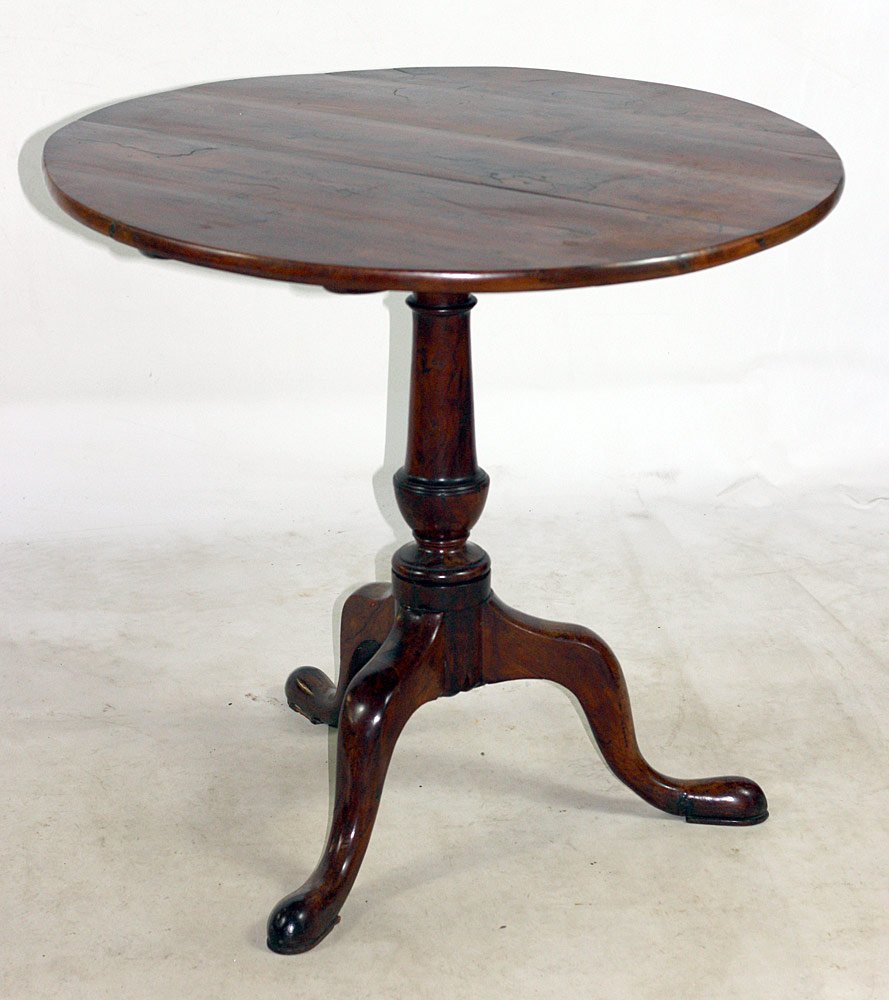 Red Cedar Tilt-Top Tea Table: Bermudian red-cedar tilt-top tea table with turned urn-form support, on cabriole legs and snake feet. 28" tall x 30-3/4" wide x 29-3/4" deep.