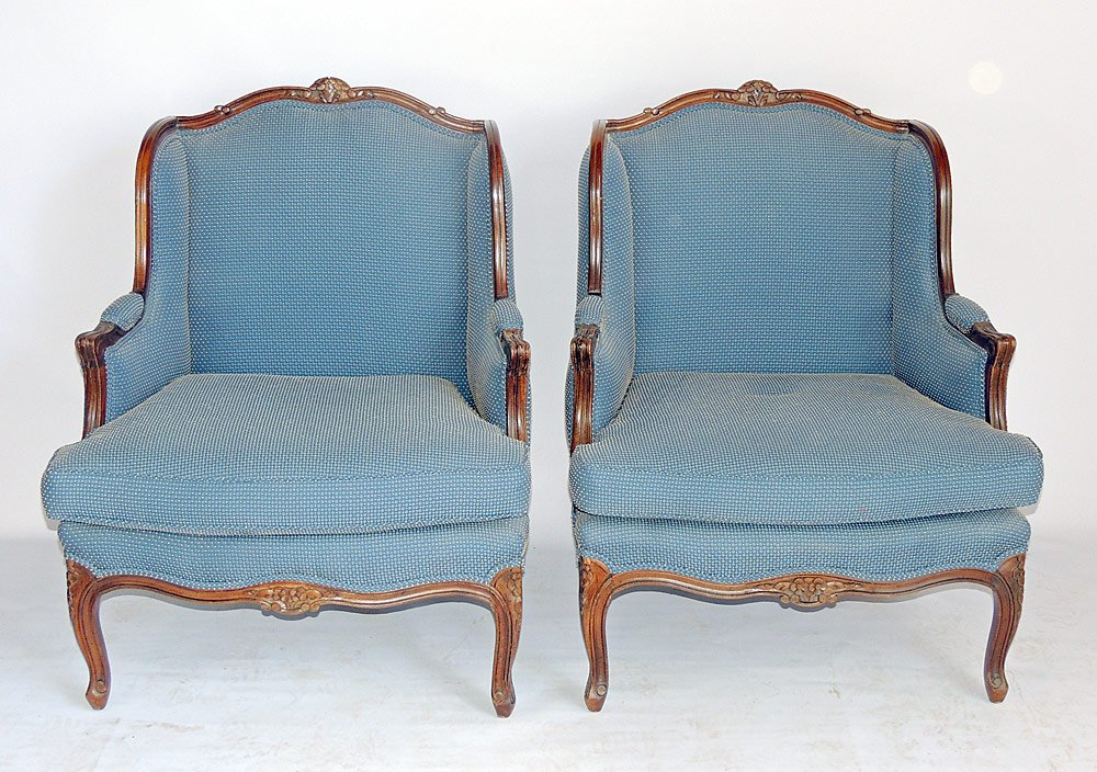 Pair of Louis XV-style Bergères: A pair of Louis XV-style bergères with blue upholstery. 35" tall, 25" wide, 25" deep. From a Villanova, PA Estate.