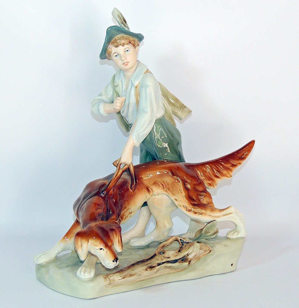 Royal Dux Bohemia Porcelain: Figural grouping of a child with his dog. 13" tall x 10" wide.