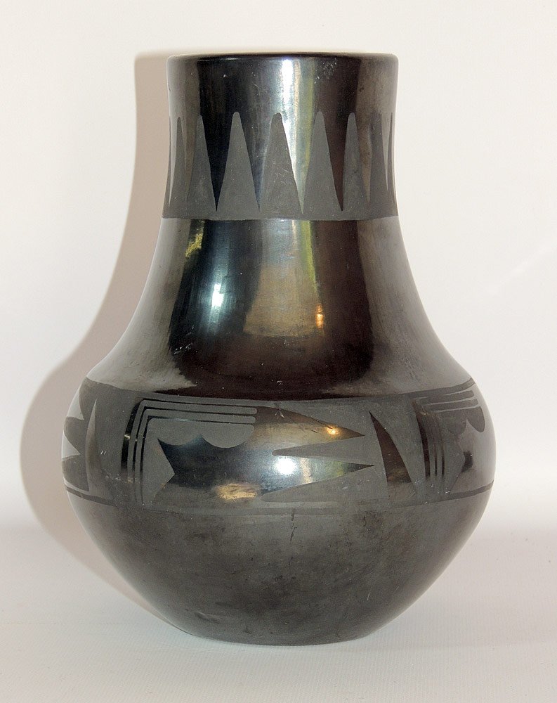 San Ildefonso Blackware Pottery Vase: Maria and Santana. Signed "Marie, Santana" on base. Decoration on median and neck. Also provided are images with Maria taken by the previous owner of the vase. 8-3/4" tall.