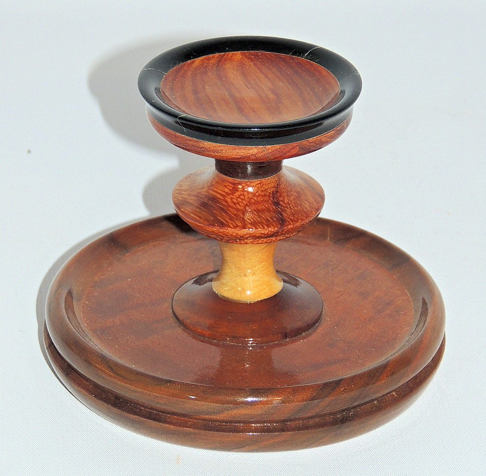 Thomas Nicosia Small Stand: Thomas Nicosia (Philadelphia 1899-1978). Small decorative stand of walnut, sepeli, maple, ebony, rosewood, tulipwood, mahogany, satinwood, and other. 4-9/16" tall x 3-9/16" diameter.
