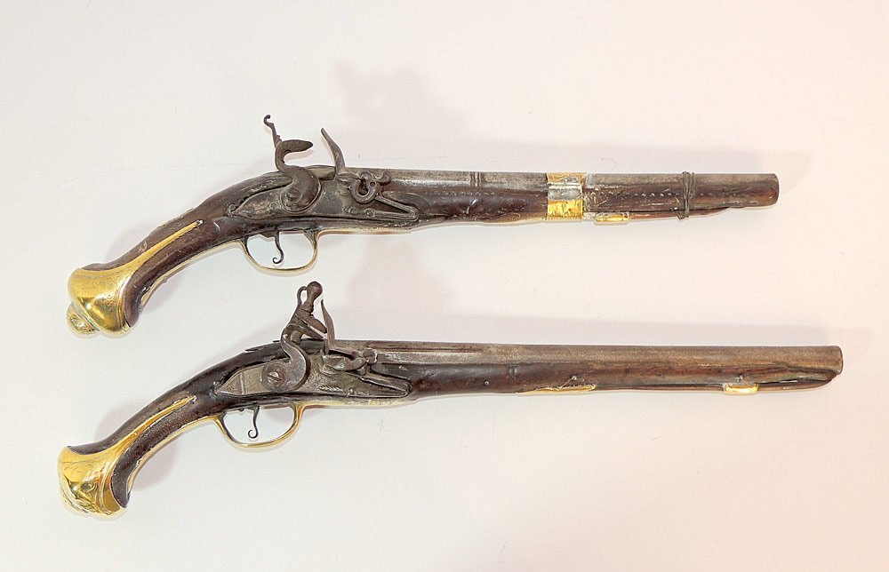Two Turkish Flintlock Pistols: Both with brass butt caps and etched markings to both barrels. Longer: 20-1/4" long.