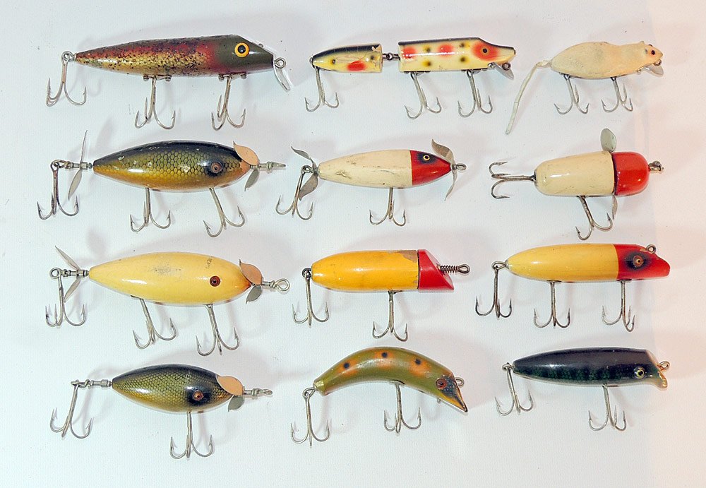 Twelve Vintage Fishing Lures: Lot to include: South Bend Teas-Oreno; South Bend Surf-Oreno; Dunk's Bubble-Header; a Heddon Meadow Mouse; Heddon Joint Vamp, and more.