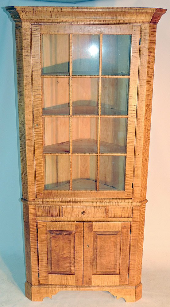 Tiger Maple Corner Cabinet: 20th Century. Two piece. 12 light. 81" tall.