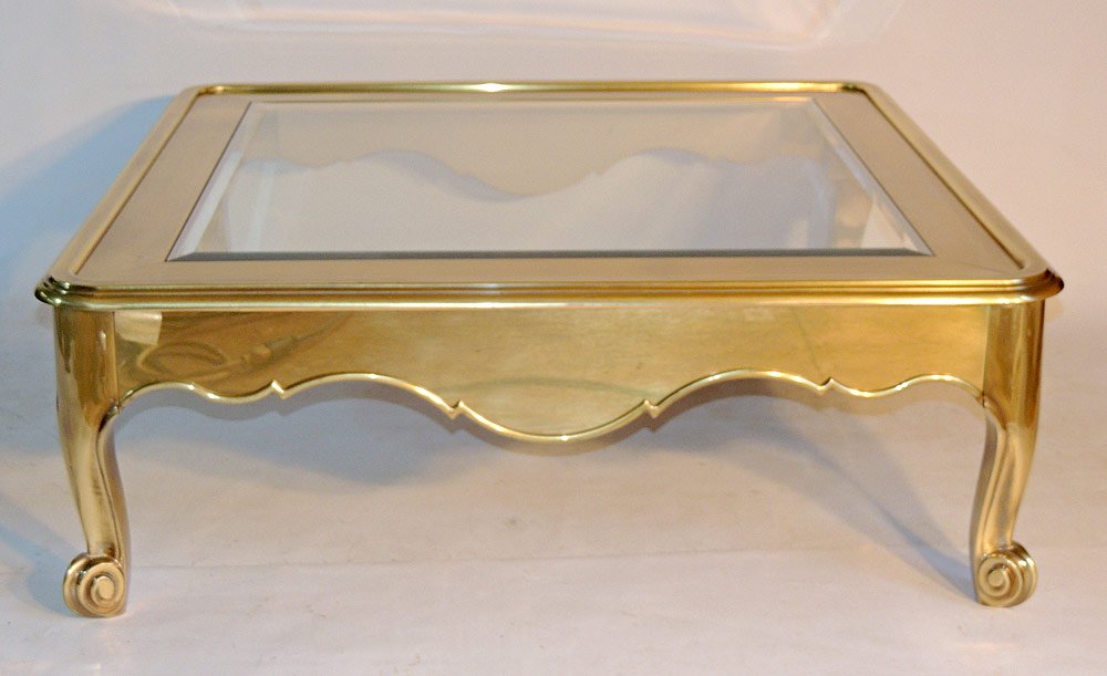 Baker Brass and Glass Coffee Table: Beveled-glass inset on brass base. 15" tall x 41" wide x 41" deep. With original sales receipt .