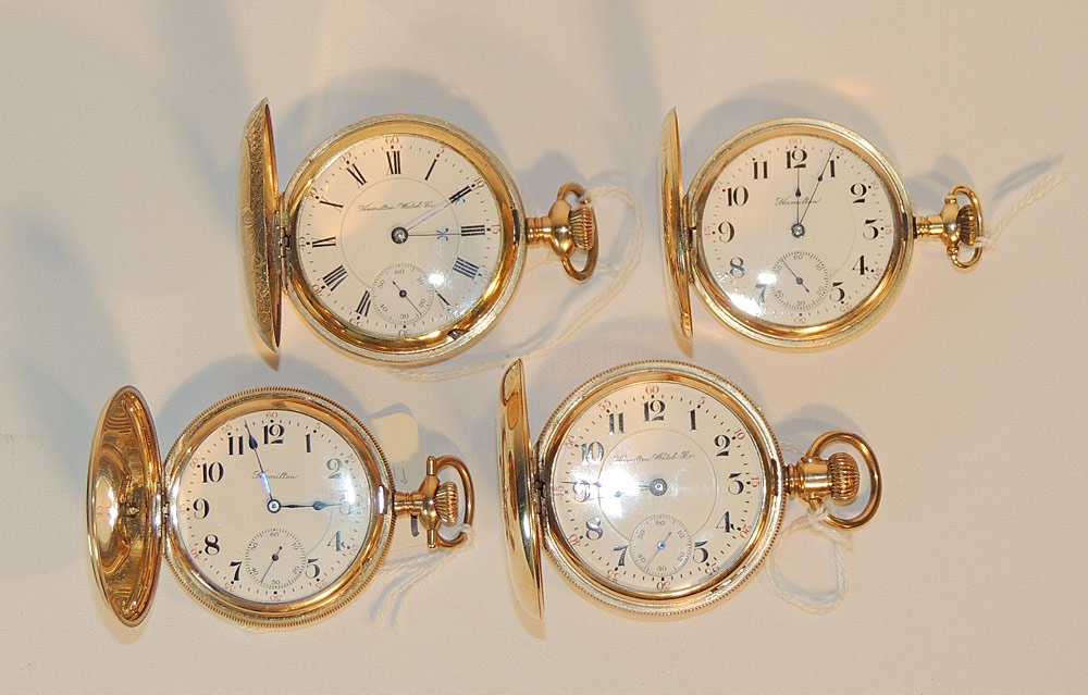 Four Hamilton Gold-filled Pocket Watches: Each with hunter case, to include: Hamilton 961. Hamilton 943. Hamilton 977. Hamilton 941. Largest 2-1/4 in. diameter.